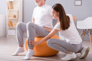 occupational therapist helping patient