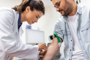 patient care technician working on a patient