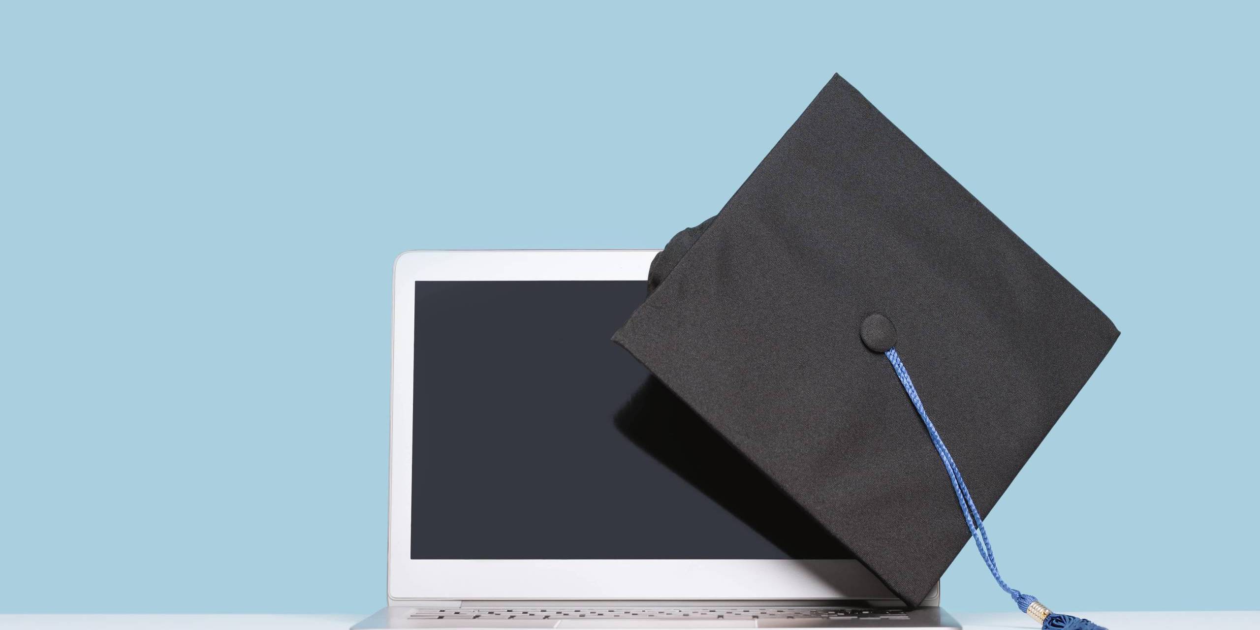 college cap and laptop computer