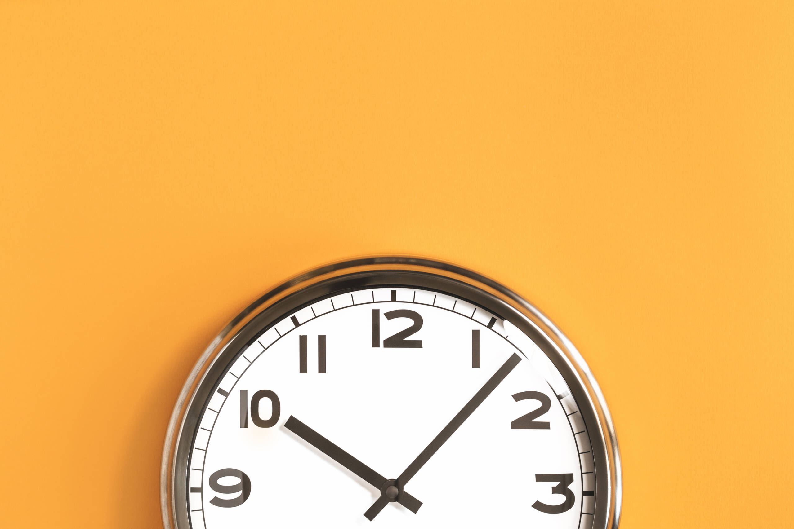 clock on a yellow wall