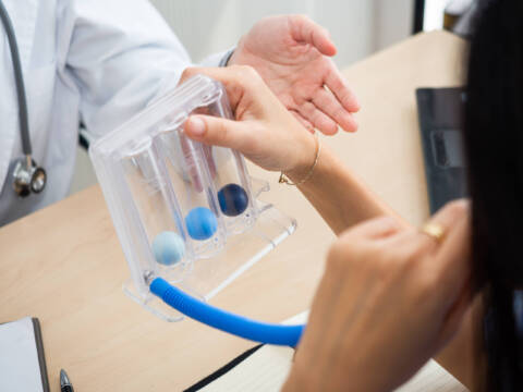 Post-Lung Surgery Care a patient is using a post op lung breathing device