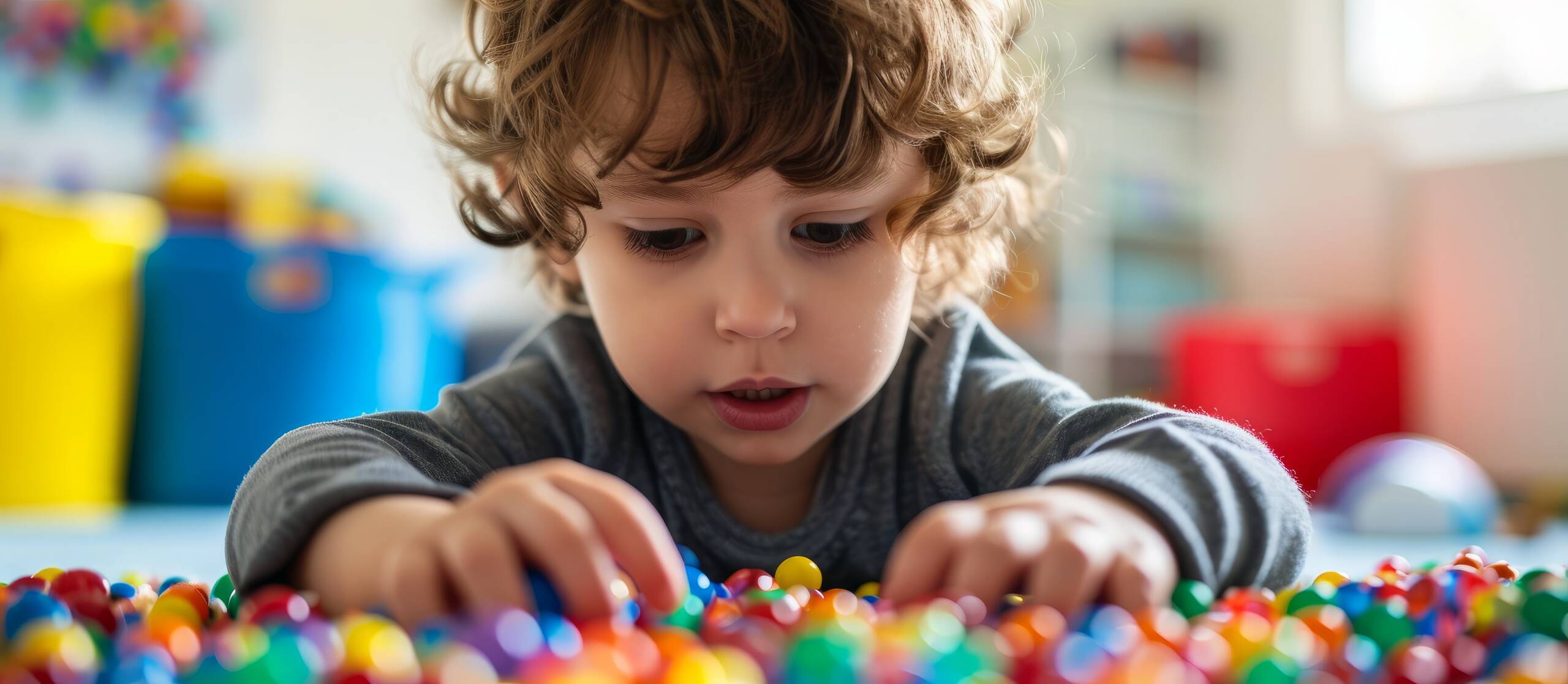 a child is performing a sensory integration during occupational therapy