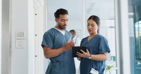 nurses lead talking to team member